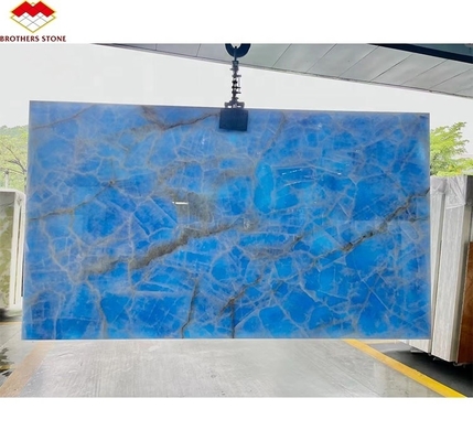 প্রাকৃতিক স্বচ্ছ নীল ওনিক্স পাথর স্ল্যাব টেলিভিশন ব্যাকগ্রাউন্ড ওয়াল প্যানেলের জন্য গোল্ডেন ব্লু